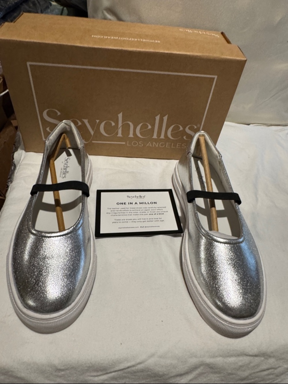 NIB Seychelles silver flats slip on size 8.